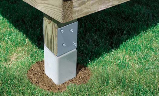 Close up of deck post installed in the ground