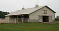 Post-frame equestrian barn